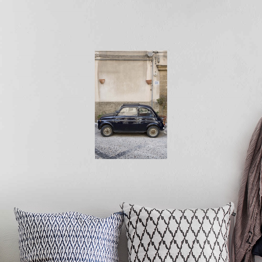A bohemian room featuring Fiat 500 car, Cefalu, Sicily, Italy