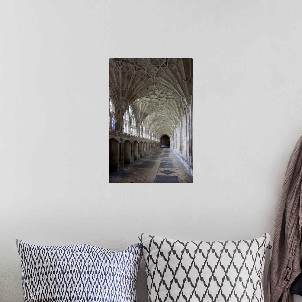 A bohemian room featuring Interior of cloisters with fan vaulting, Gloucestershire, England, UK