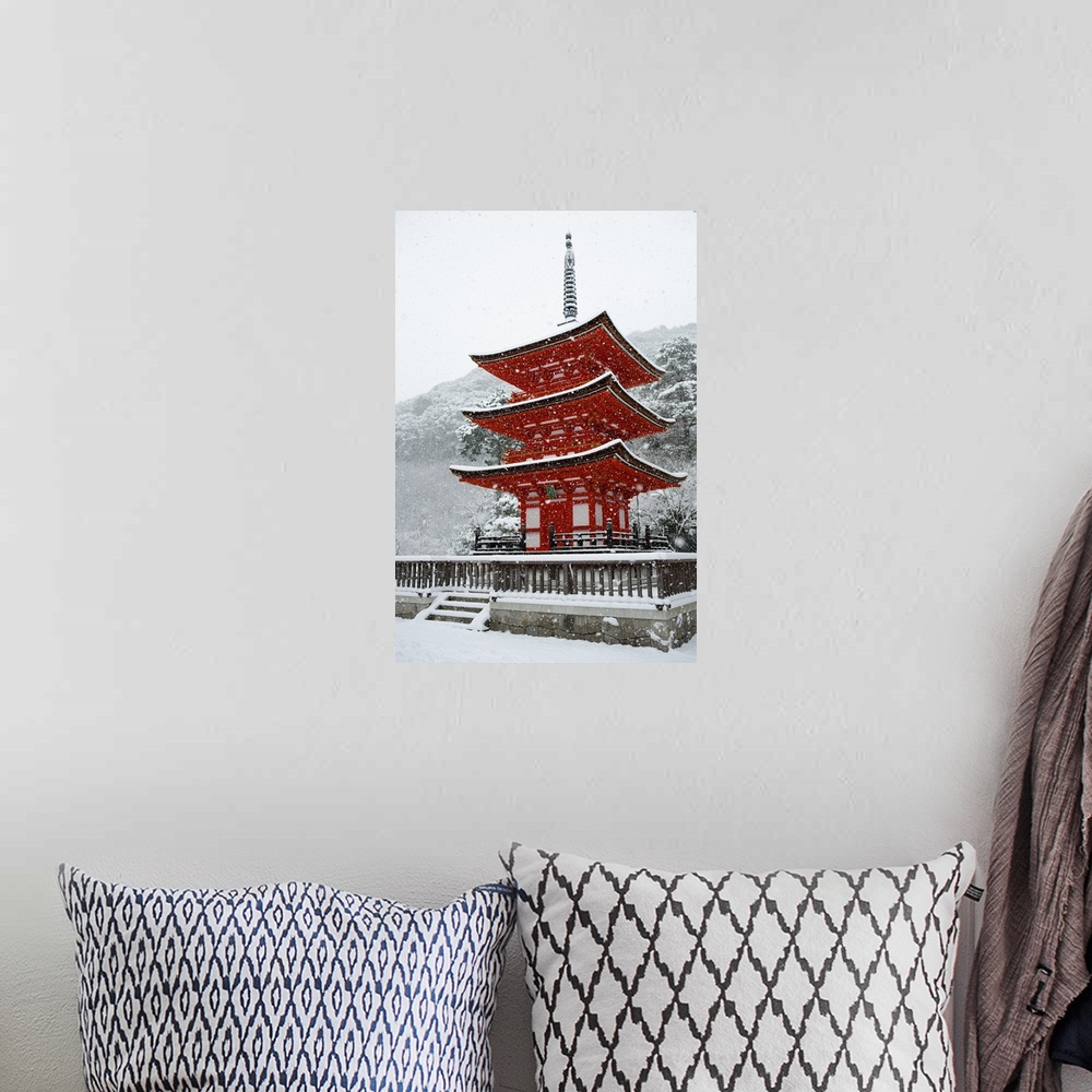 A bohemian room featuring Snow falling on small red pagoda, Kiyomizu-dera Temple, Kyoto, Japan