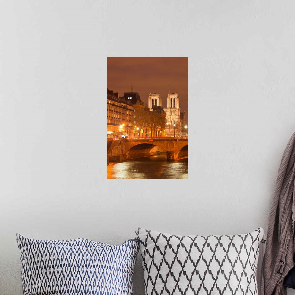 A bohemian room featuring The Ile de la Cite and Notre Dame cathedral at night, Paris, France, Europe