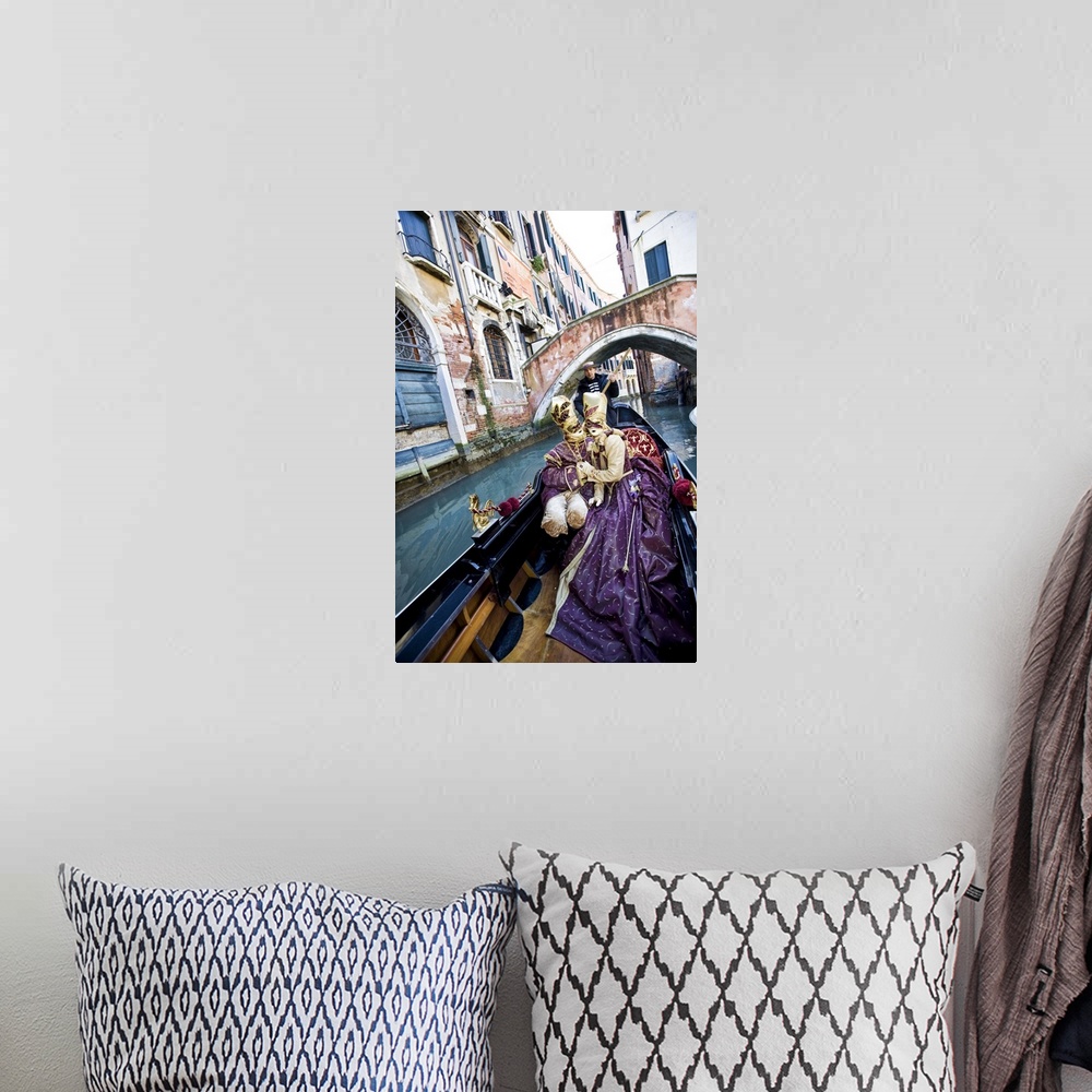 A bohemian room featuring Couple in Masquerade outfits kissing in Gondola underneath bridge, Venice, Italy