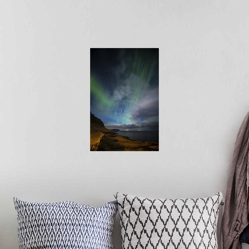 A bohemian room featuring Aurora borealis above the coast in Iceland.