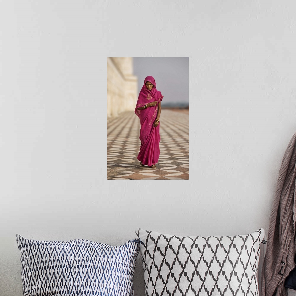 A bohemian room featuring Indian woman in red dress walking by the Taj Mahal, Agra, India