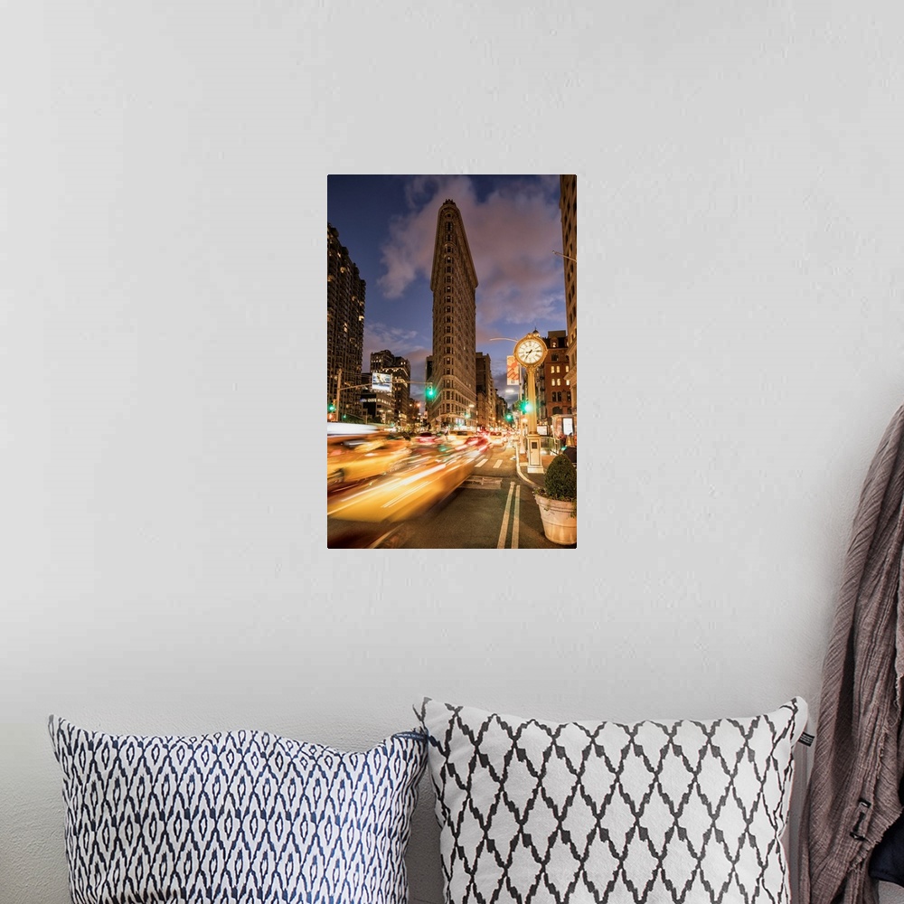 A bohemian room featuring The Flatiron Building in New York City at sunset