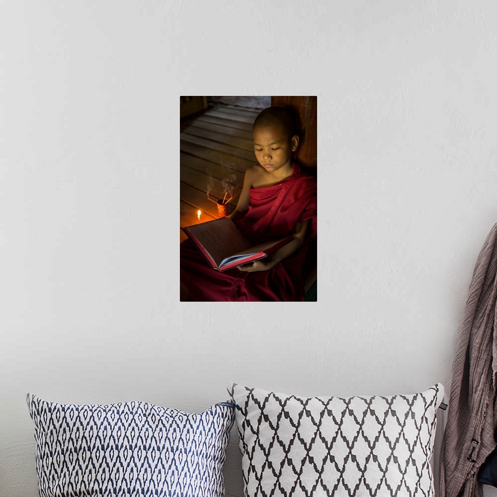 A bohemian room featuring Young Burmese monk in his monastery in Bagan.
