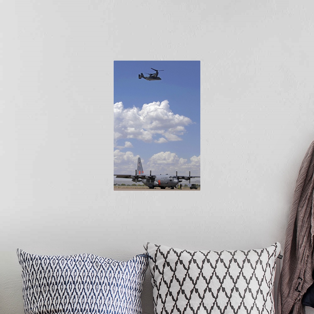 A bohemian room featuring A CV22 Osprey flies over a C130 Hercules