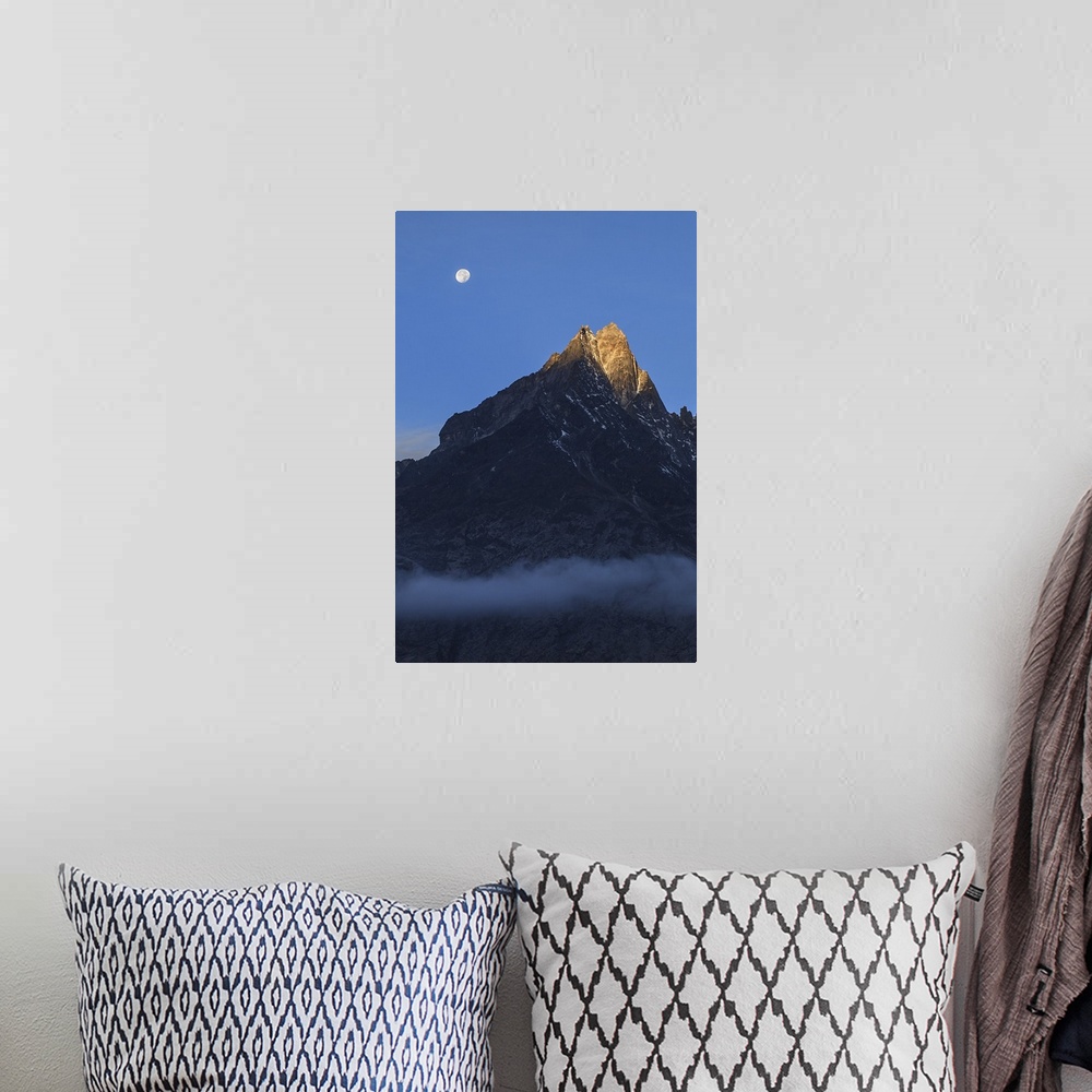 A bohemian room featuring Moonset and alpenglow over a snow peak in the Himalayas as seen from Sagarmatha National Park of ...