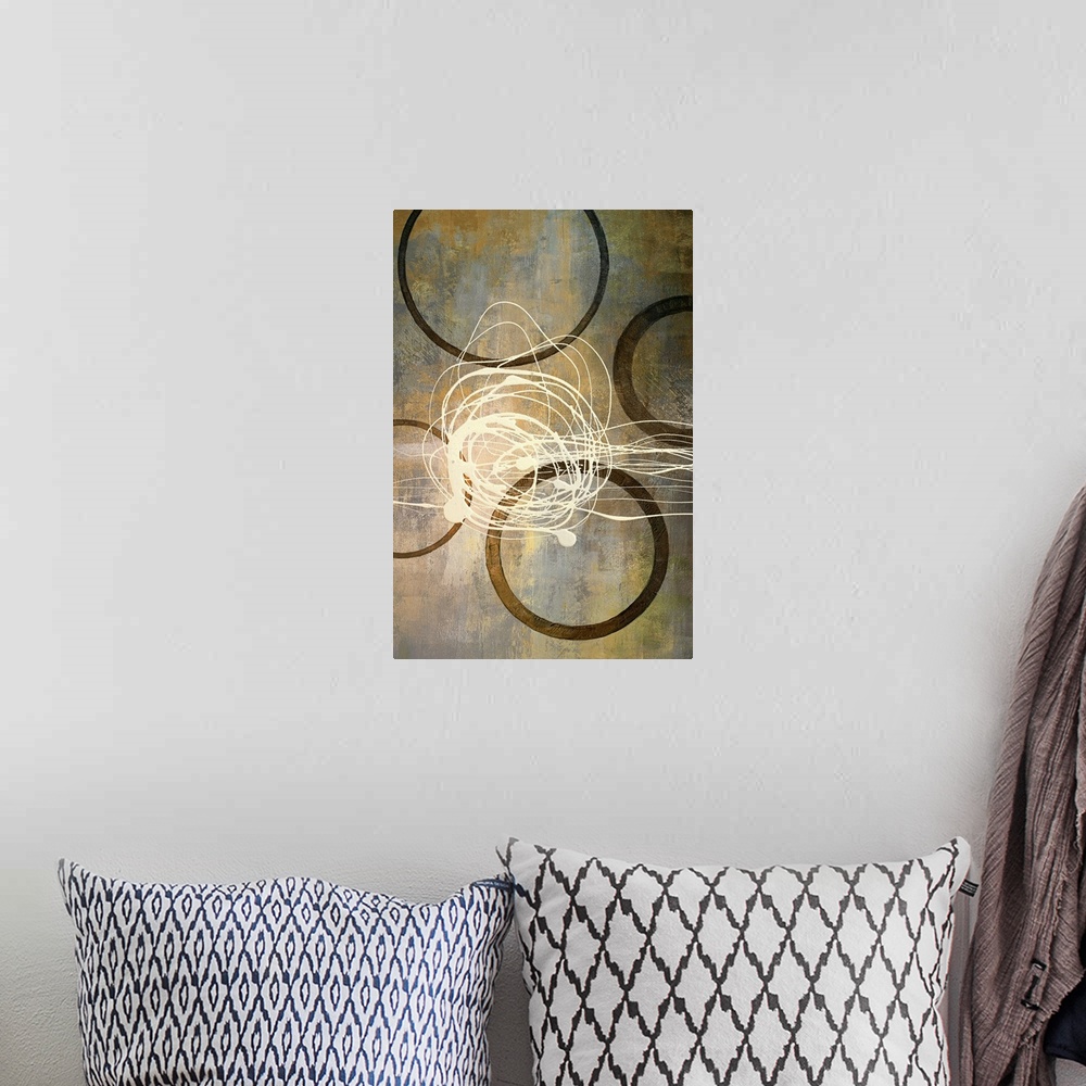 A bohemian room featuring Abstract artwork that consist of four brown circles with an off white scribble in the middle.