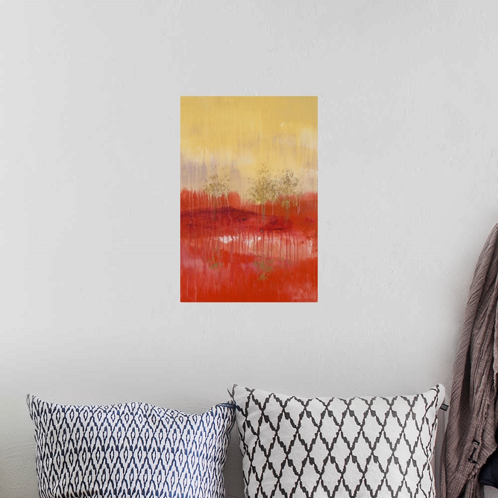 A bohemian room featuring Abstract painting of a red and yellow landscape with golden trees.