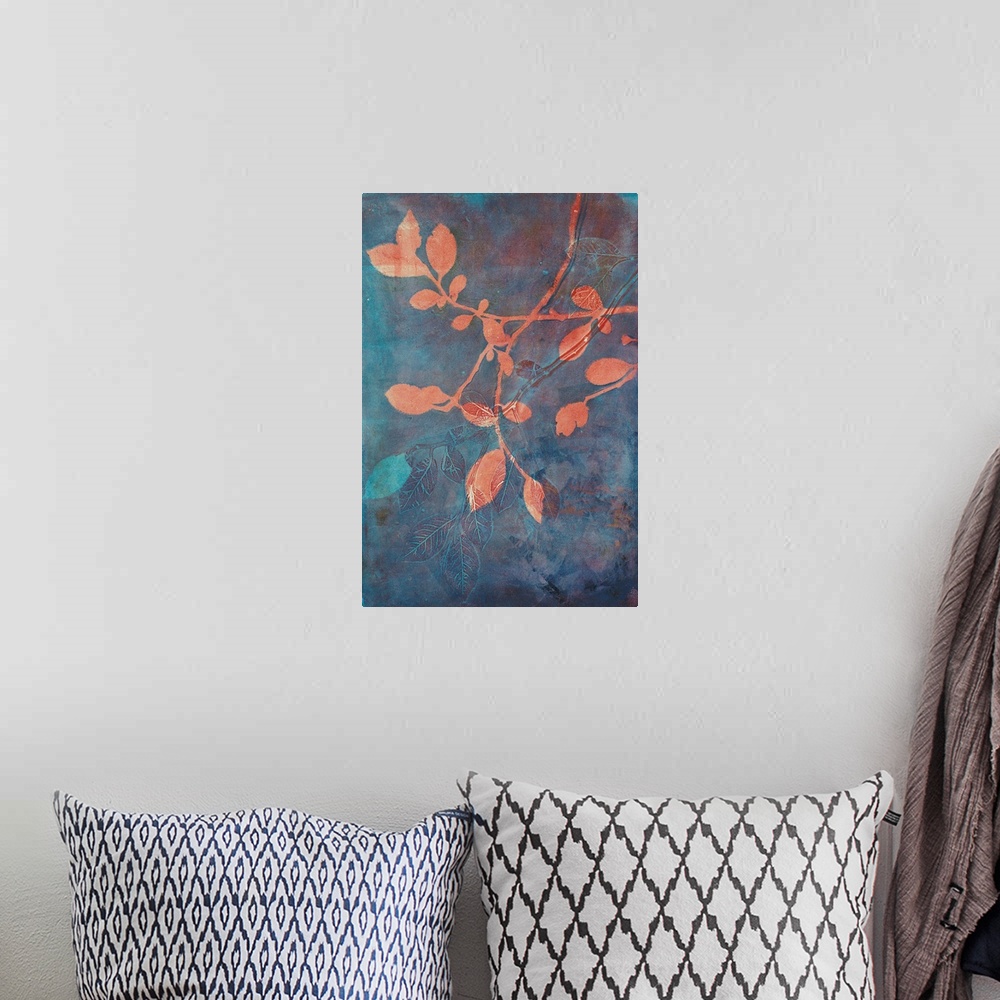 A bohemian room featuring A stunning contemporary cyanotype image featruing coral colored branches against a blue and rust ...