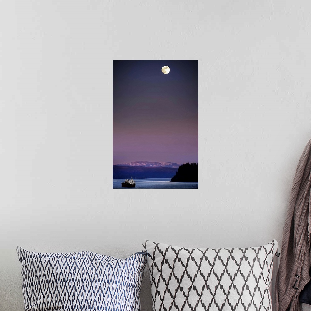 A bohemian room featuring A full moon at night above snow capped mountains and a ship