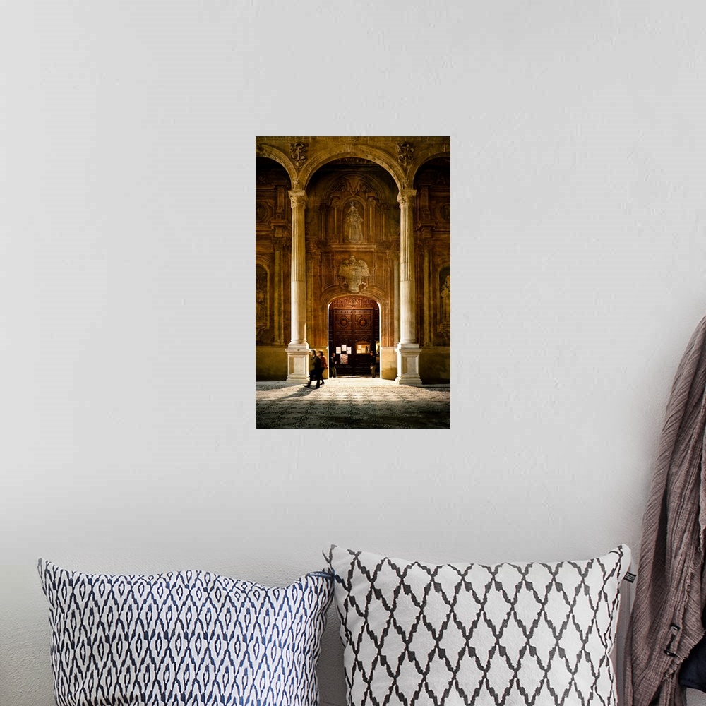 A bohemian room featuring Some people at the entrance of the Santo Domingo Church in Granada, Spain