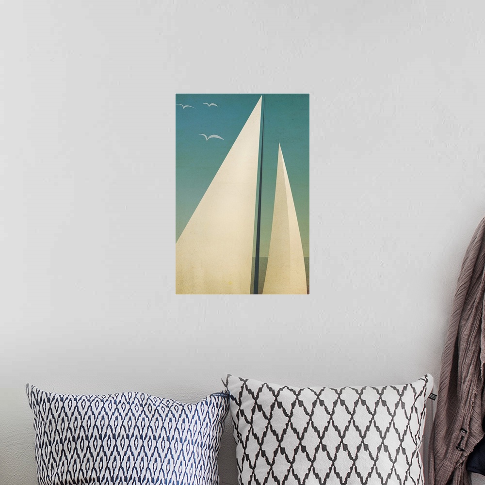 A bohemian room featuring Contemporary artwork of sails seen against a dark blue sky.