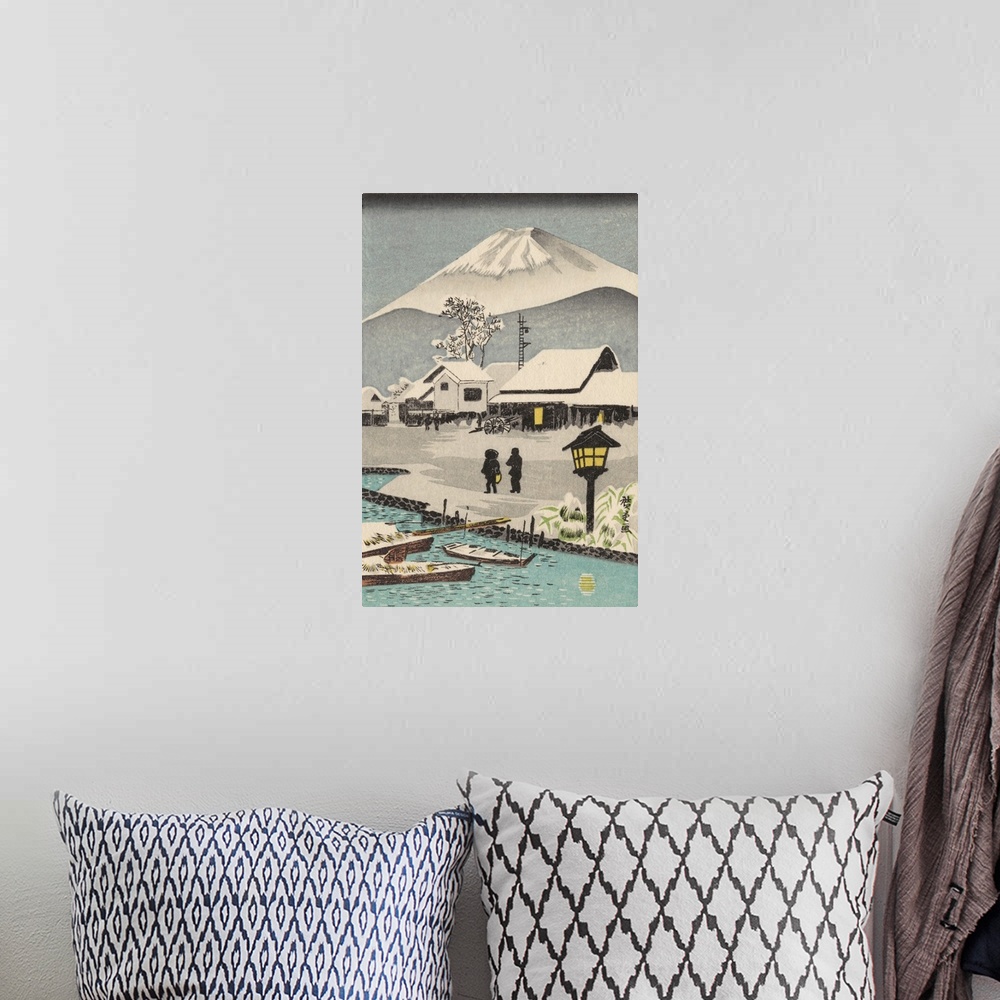A bohemian room featuring Eastern art of snowy village scene with Mount Fuji in the background.