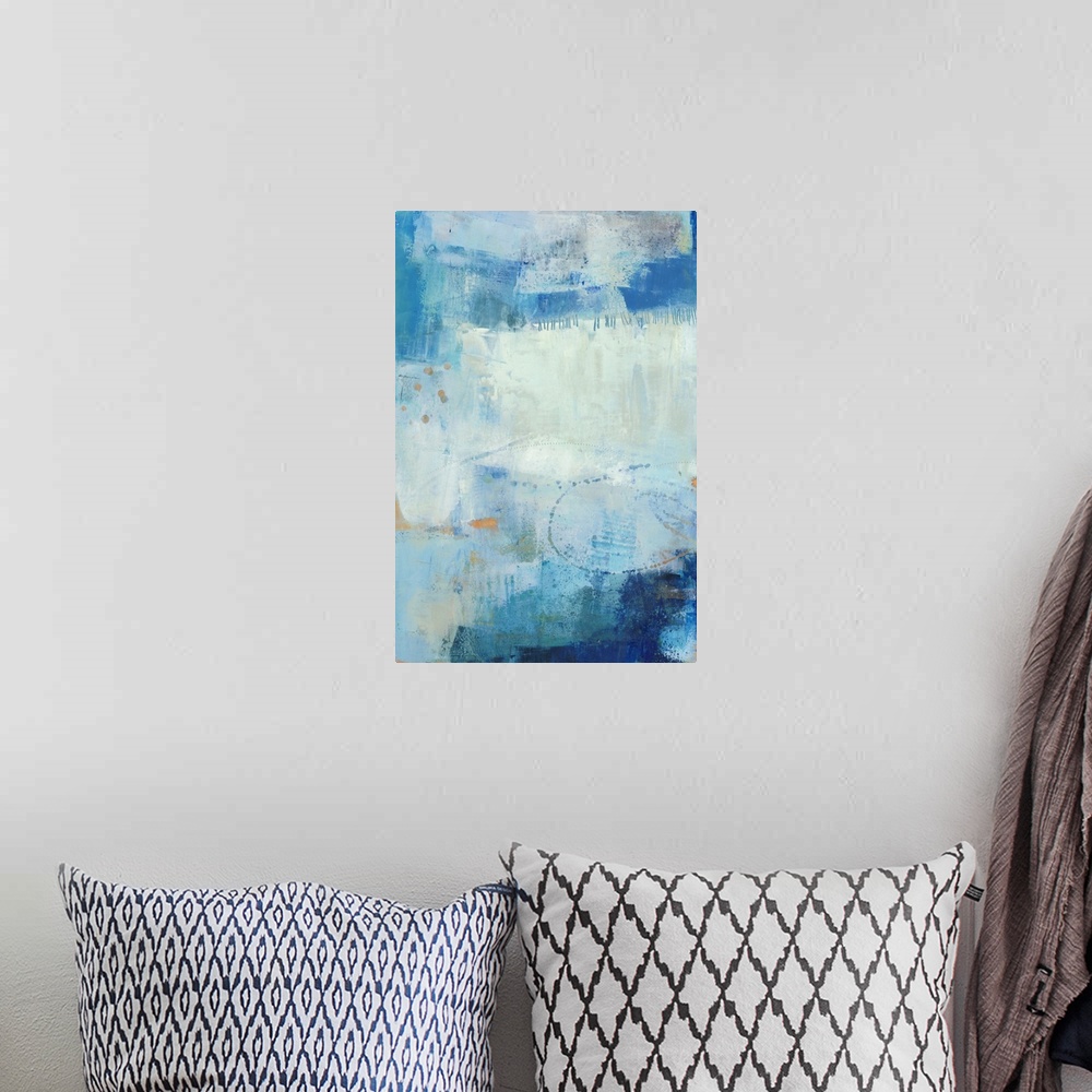 A bohemian room featuring Vertical abstract painting made in shades of blue with gold accents and lines etched in the thick...