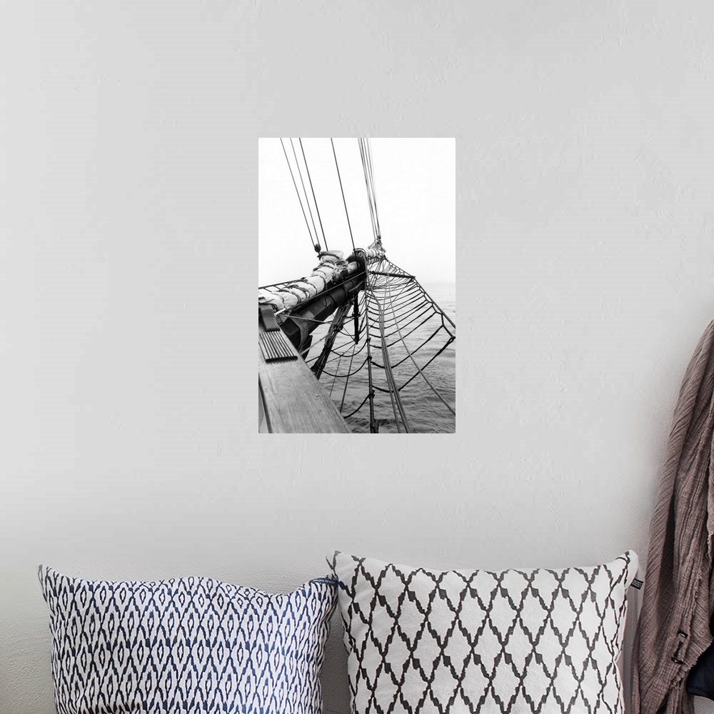 A bohemian room featuring Black and white photograph of details of a sailboat.