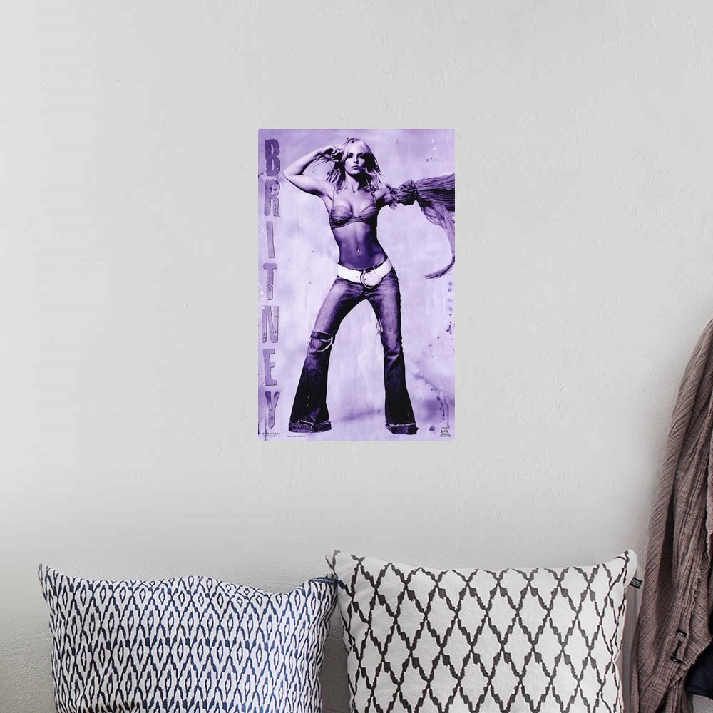 A bohemian room featuring Oversized, vertical music poster on a wall hanging of Britney Spears, standing with arms raised, ...