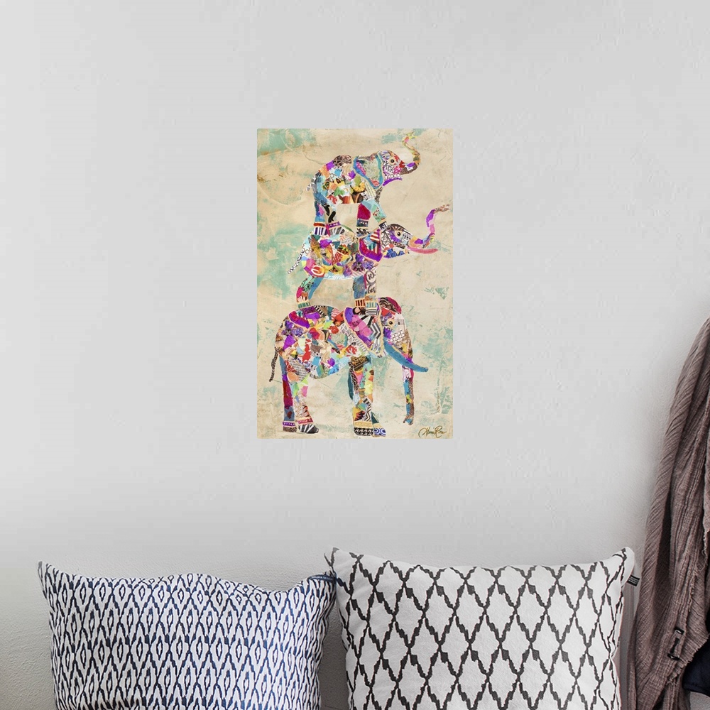 A bohemian room featuring Painting of three colorful different sized elephants standing on top of each other.