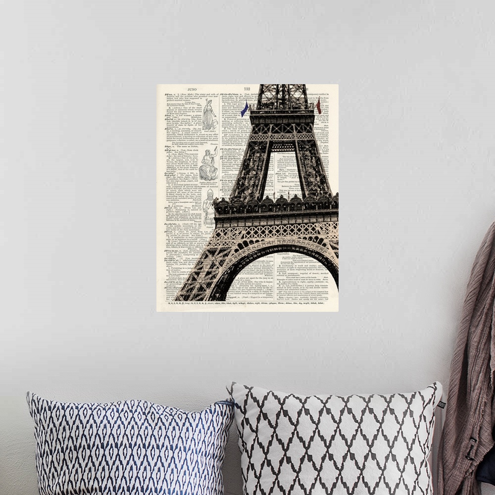A bohemian room featuring Contemporary artistic use of a page from a dictionary with the Eiffel Tower on top of the text.