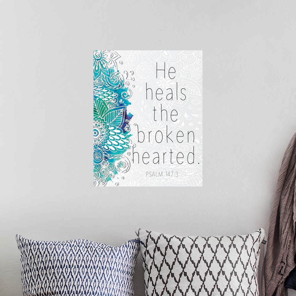 A bohemian room featuring Bible verse Psalm 147:3 with a blue floral design.