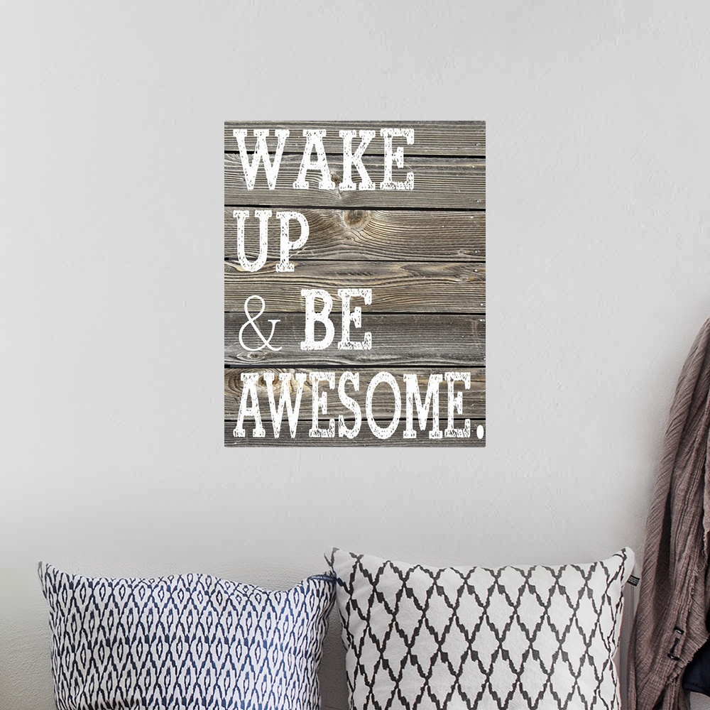 A bohemian room featuring The phrase "Wake Up and Be Awesome." printed on a faux wooden board texture.