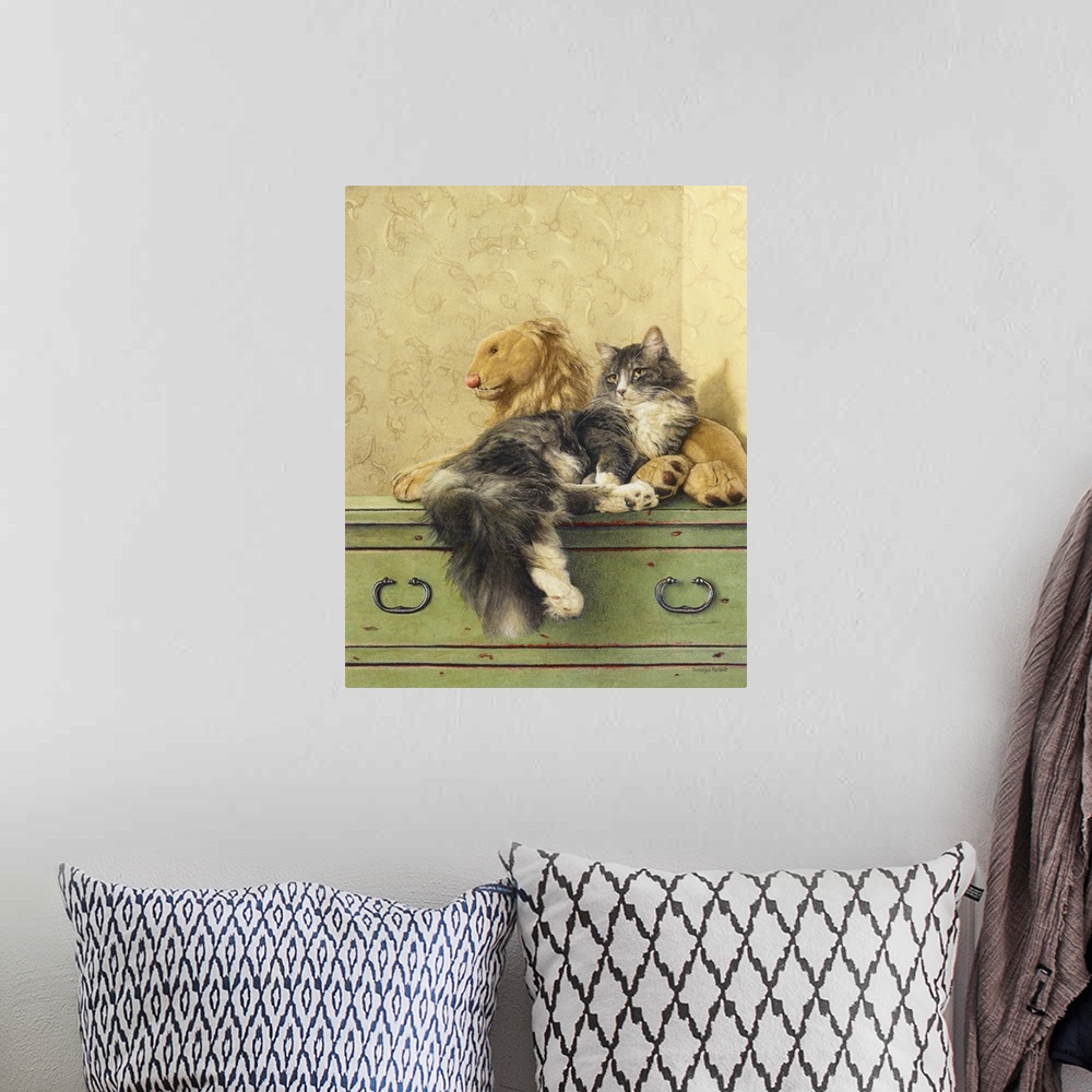 A bohemian room featuring A vertical image of a gray and white cat laying on a dresser with a stuffed lion.
