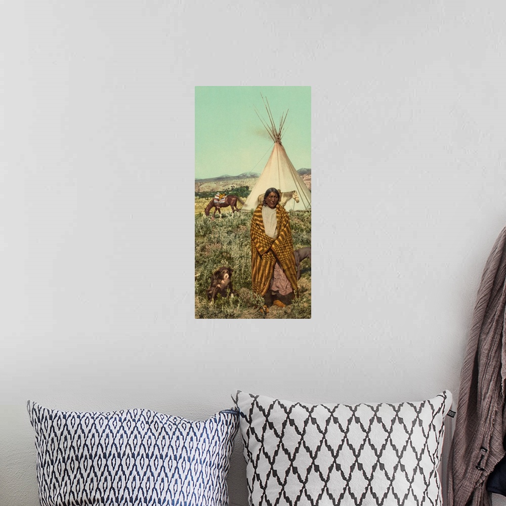 A bohemian room featuring Hand colored photograph of a crow native American.