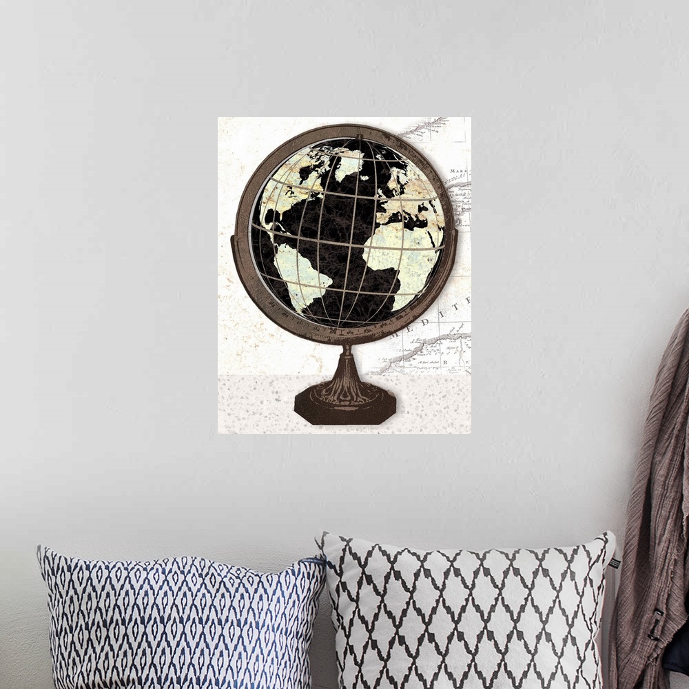 A bohemian room featuring Artwork of an antique old world globe, against a map print background.