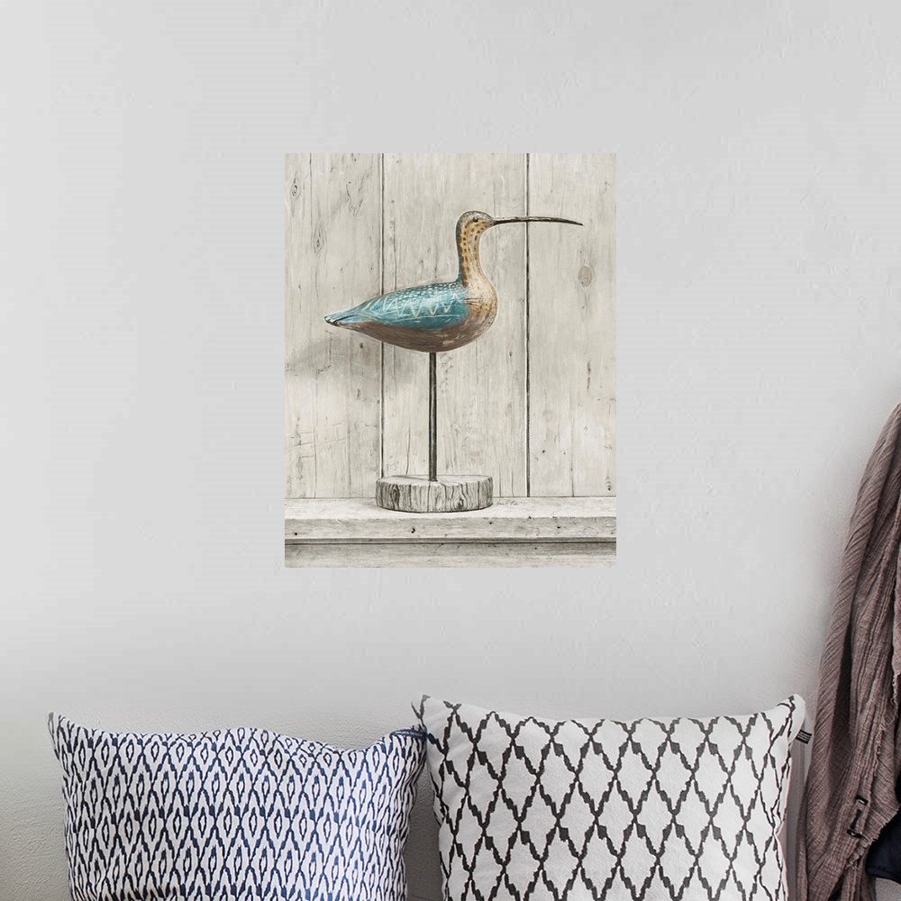 A bohemian room featuring Contemporary coastal themed artwork of a wooden bird statue against a washed wood background.