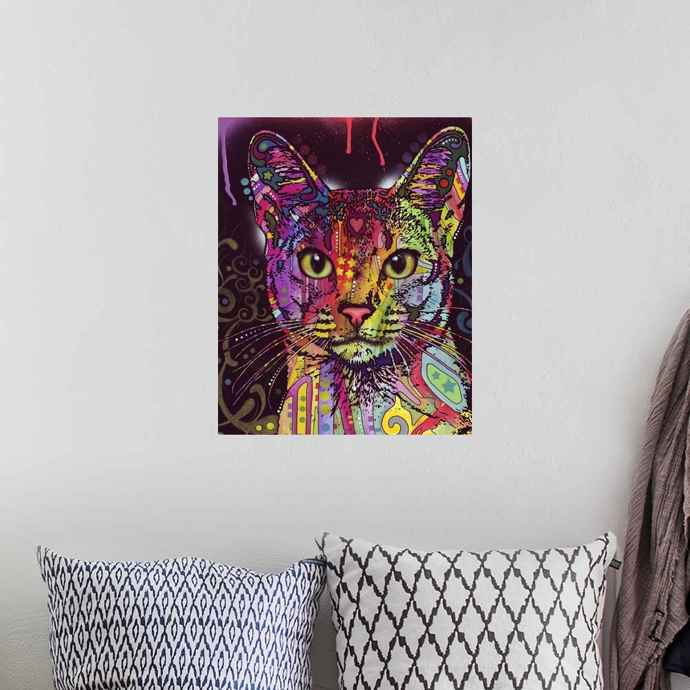 A bohemian room featuring Large abstract painting of a cat made up of different colors and patterns.