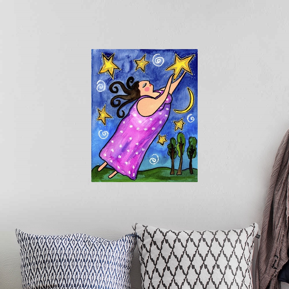 A bohemian room featuring A woman in pink raising her arms toward the stars in the sky.