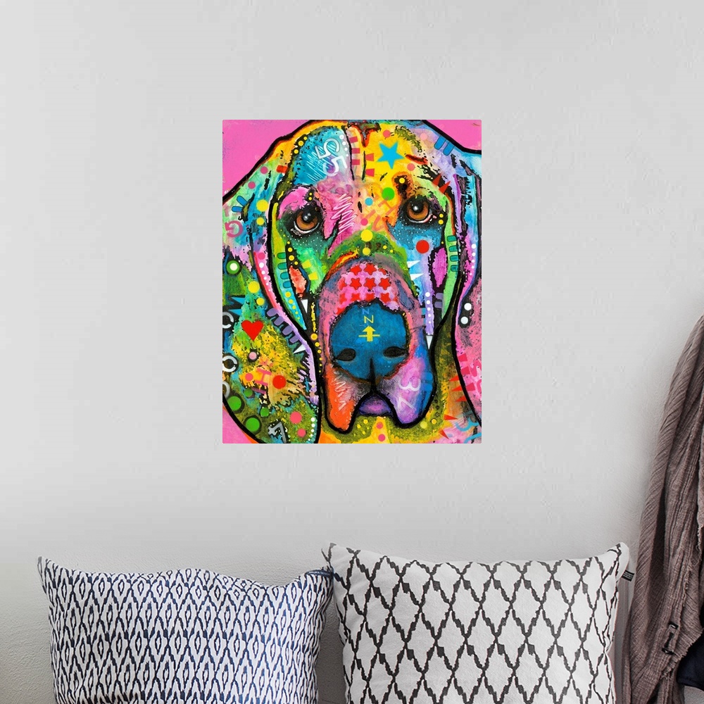 A bohemian room featuring Colorful painting of a Bloodhound with abstract markings all over on a bright pink background.