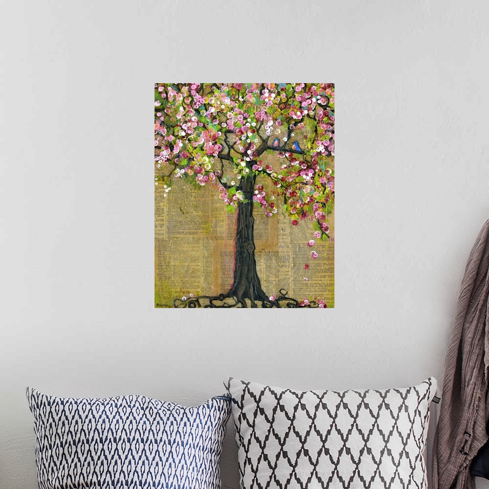 A bohemian room featuring Lighthearted contemporary painting of a flowering tree, against a newsprint background.