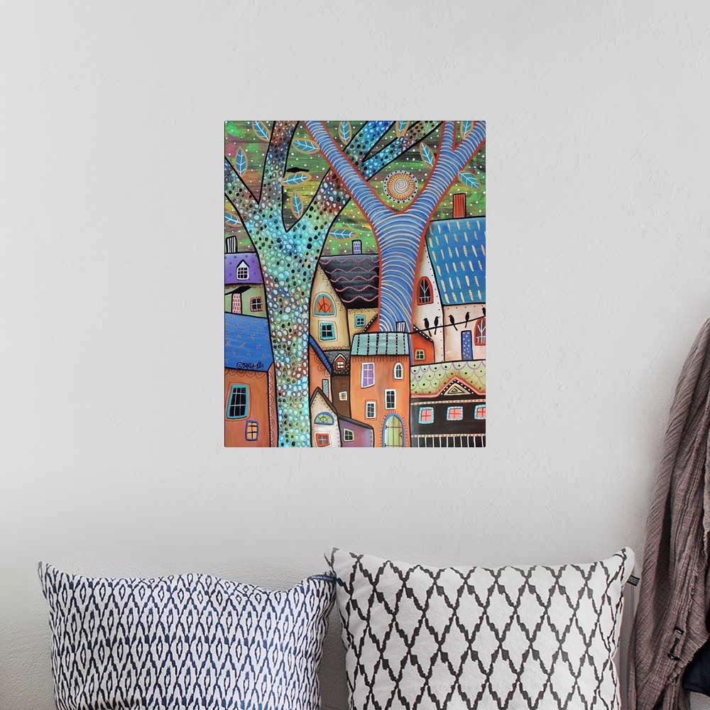 A bohemian room featuring Contemporary painting of a village made of different colored houses with large colorful trees.