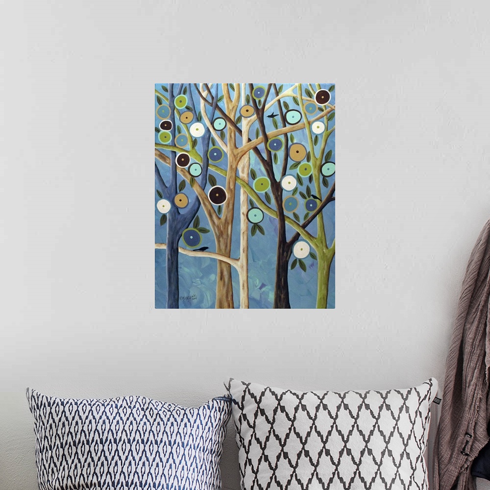 A bohemian room featuring Contemporary painting of a forest of trees with long branches and round flowers.