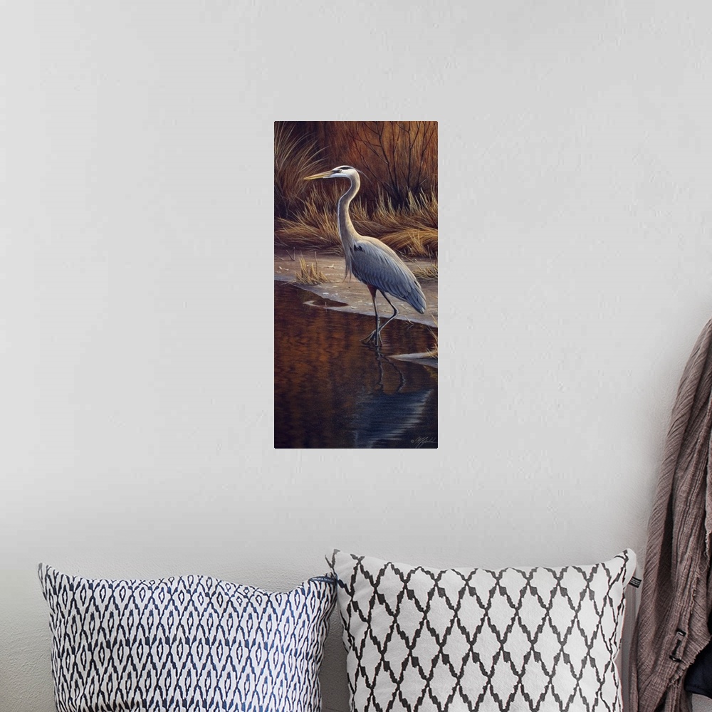 A bohemian room featuring Heron standing at the edge of the water.