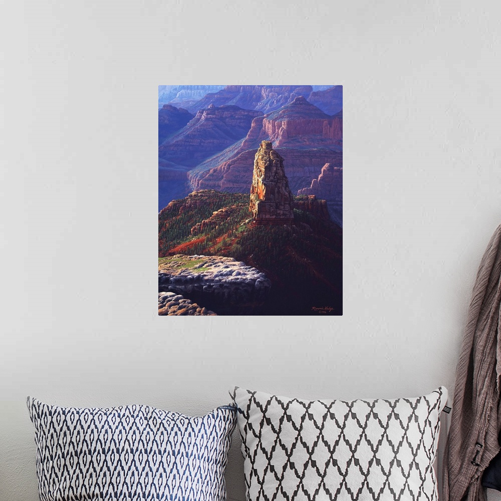 A bohemian room featuring A tall natural landmark stands against the backdrop of the canyon walls.
