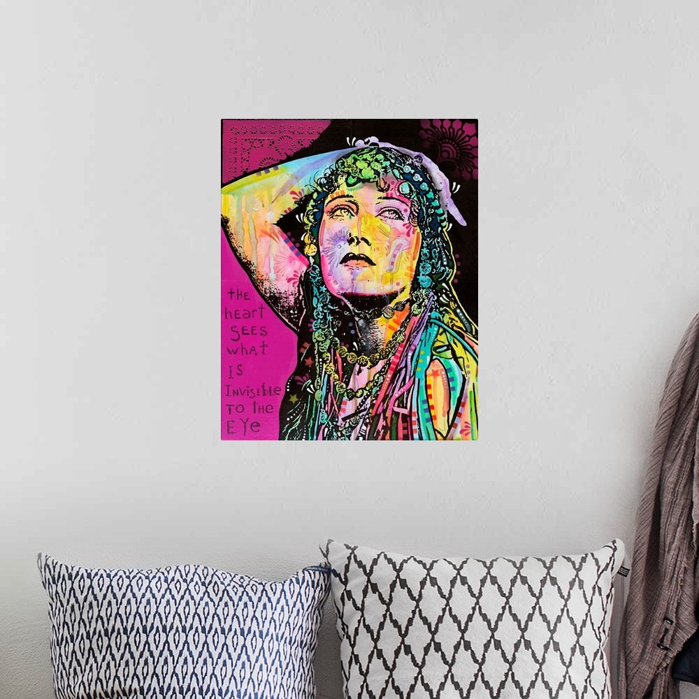A bohemian room featuring Pop art style artwork of a colorful woman with graffiti like designs on a bright magenta backgrou...