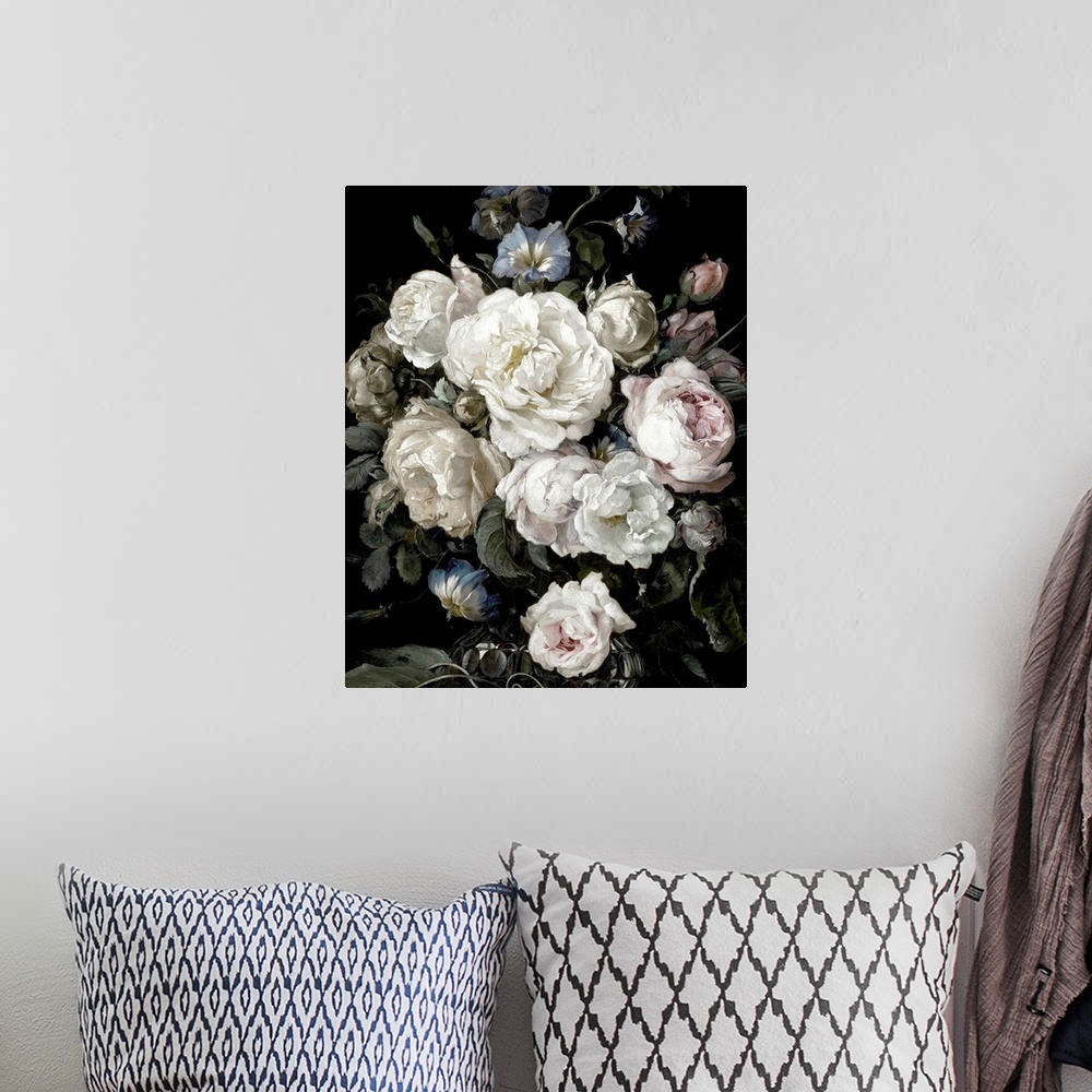 A bohemian room featuring Desaturated artwork showing a romantic bouquet of flowers in a vase  over a dark background.