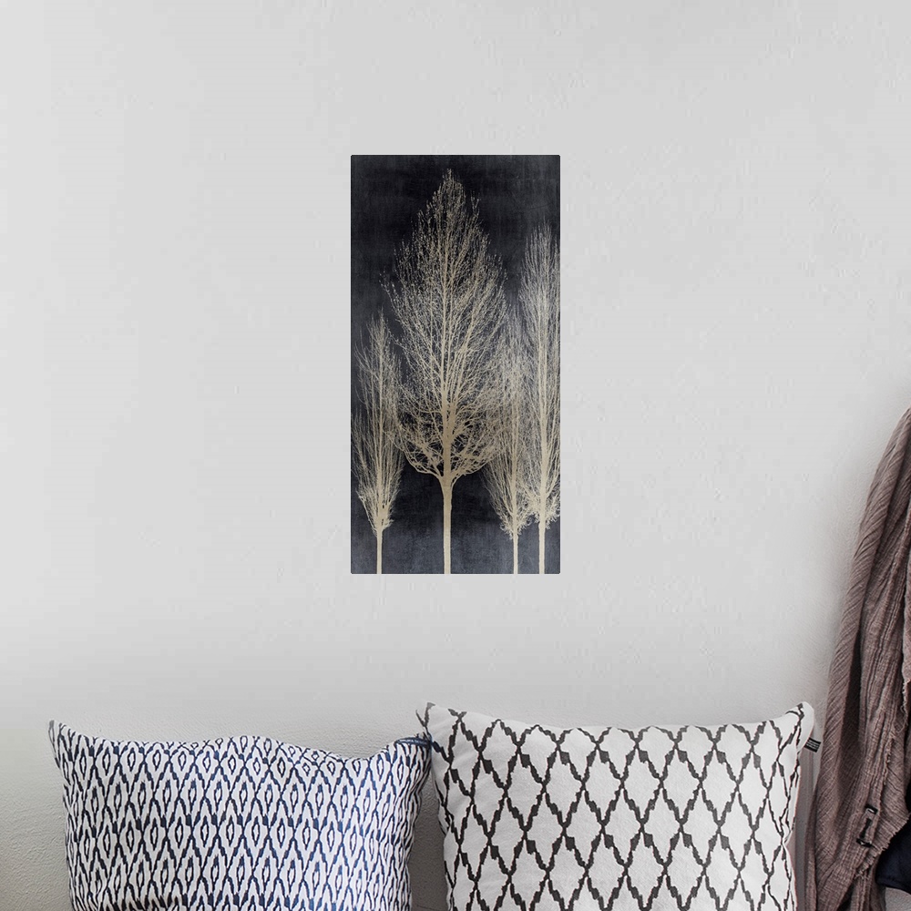A bohemian room featuring Decorative artwork featuring an aged silver silhouette of leafless trees over a distressed backgr...