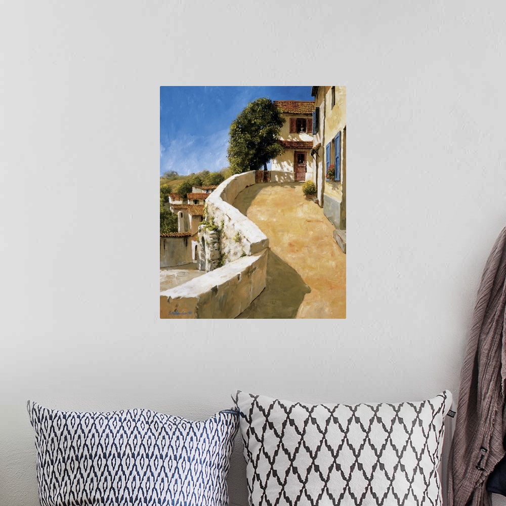 A bohemian room featuring Painting of a walkway in a European village.