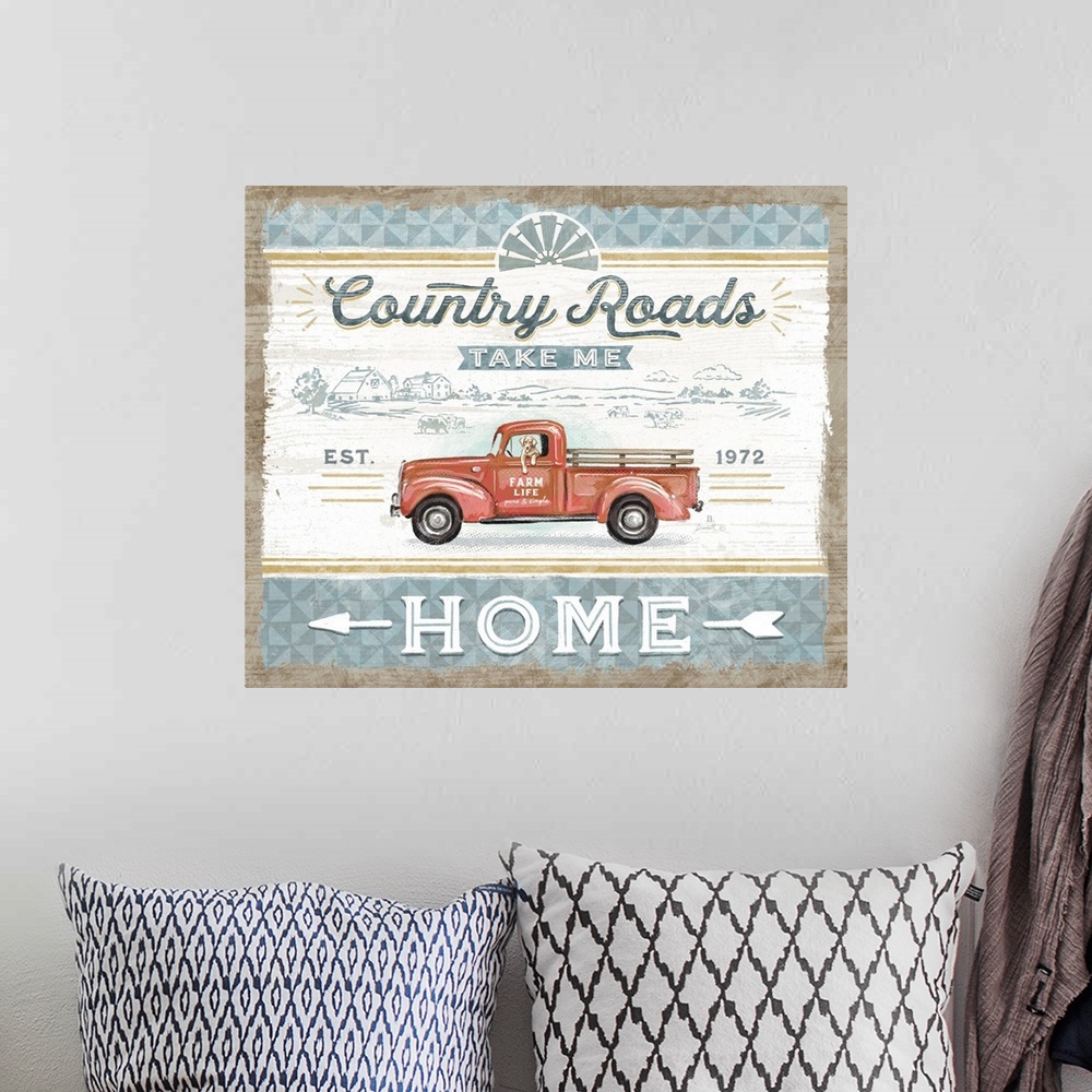A bohemian room featuring Vintage farmhouse signage of a rustic red truck evokes a classic country style