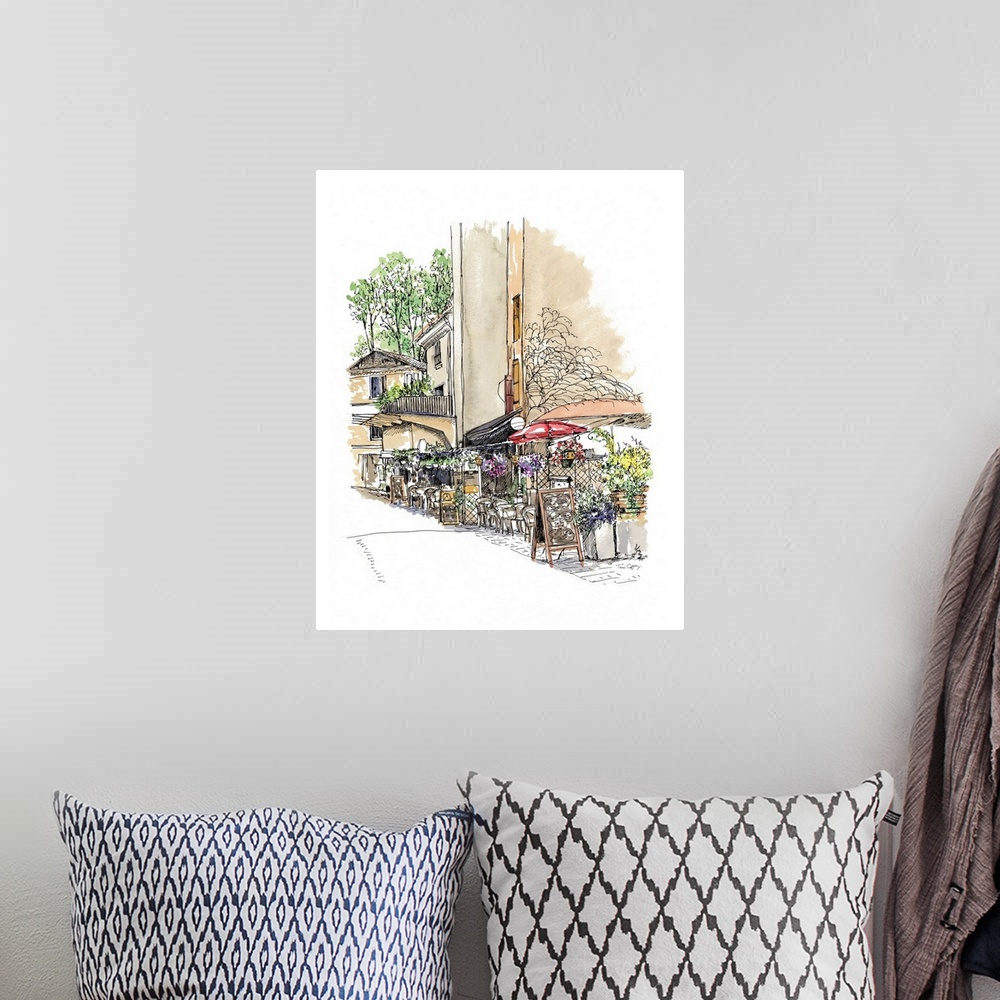 A bohemian room featuring A lovely pen and ink depiction of a European street scene.