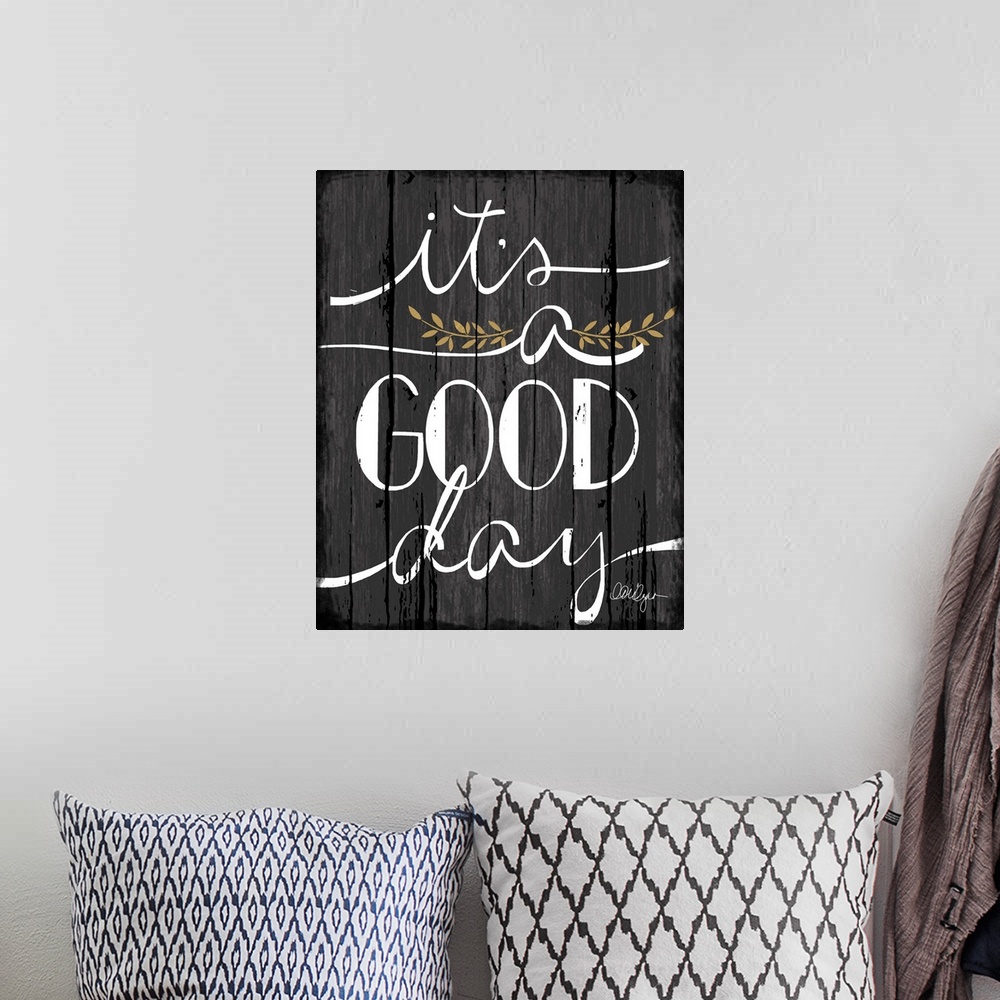 A bohemian room featuring Font-driven sign art conveys a wonderful sentiment about love and home, "It's a Good Day"