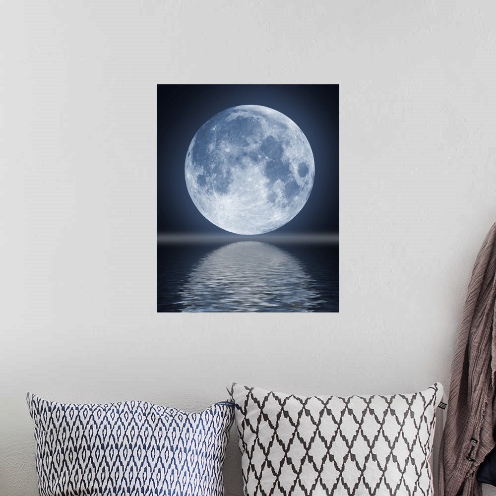 A bohemian room featuring The full moon in the night sky reflected in water.