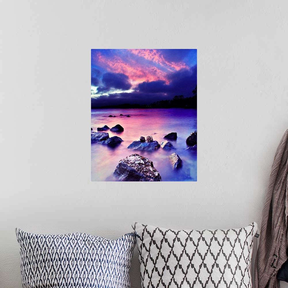 A bohemian room featuring A romantic art print for valentines under a pink and blue sky.