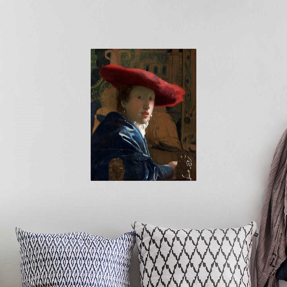 A bohemian room featuring Girl with the Red Hat, by Johannes Vermeer, c. 1665-66, Dutch painting, oil on canvas. Portrayed ...