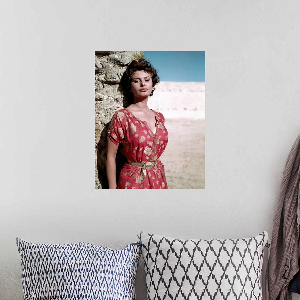 A bohemian room featuring Vintage publicity photo of actress Sophia Loren on the beach.