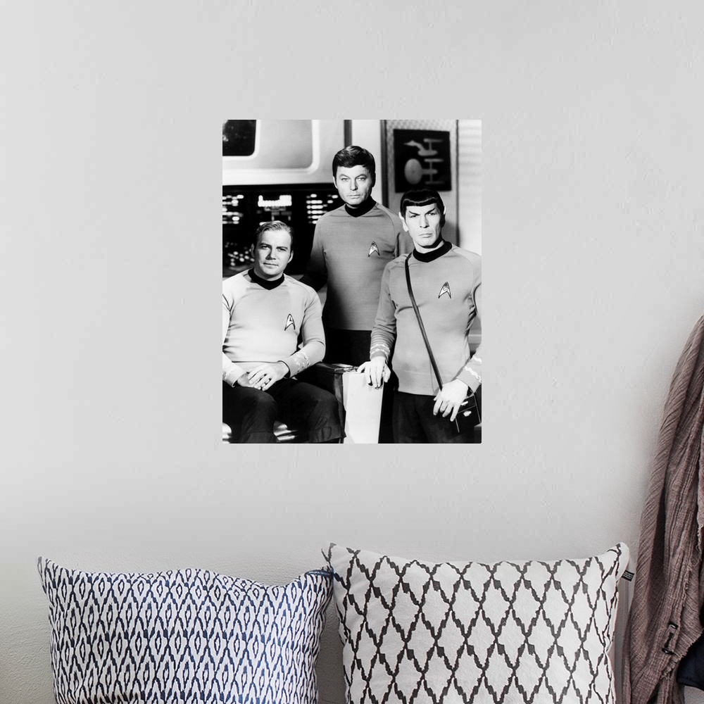A bohemian room featuring Black and white photograph of William Shatner,  DeForest Kelley, Leonard Nimoy.