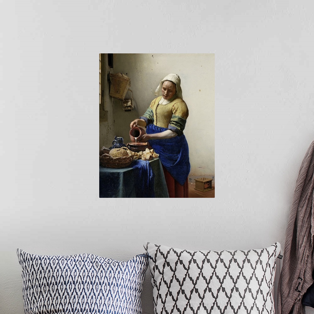 A bohemian room featuring The Milkmaid, by Johannes Vermeer, 1660, Dutch painting, oil on canvas. Illuminated by light from...